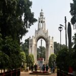 Photograph of the iconic entrance archway at Allahabad University in Prayagraj, India.