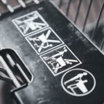 Safety instructions on a shopping cart highlight proper usage for child safety.