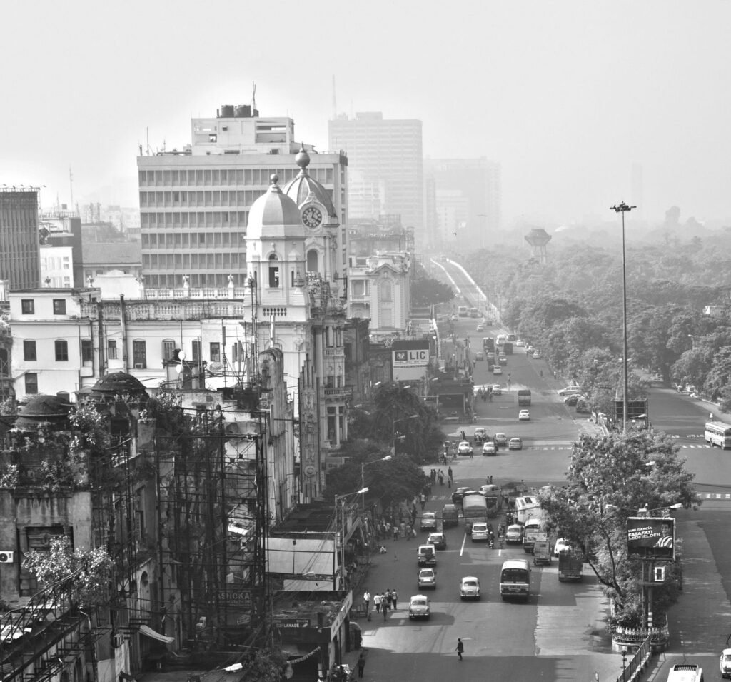 Aerial view of Kolkata cityscape showcasing historic architecture and urban life.