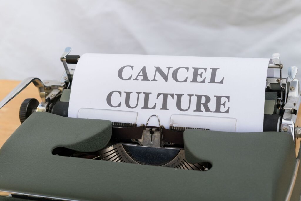 Close-up of a vintage typewriter with paper reading 'Cancel Culture', signifying social media trends.