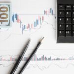 Stock analysis workspace featuring charts, a calculator, and currency for data-driven insights.