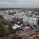 Drone shot capturing Chennai's bustling cityscape and modern architecture from above.