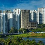 Stunning cityscape of Kochi's modern skyline with high-rise apartments and lush greenery.