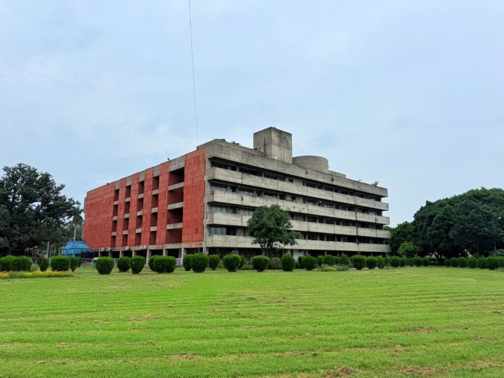 Concrete BR Ambedkar Administrative Building nestled in green garden, Chandigarh.