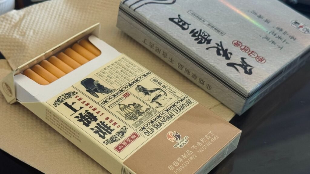 Open box of nicotine-free teabacco with vintage Shanghai design.