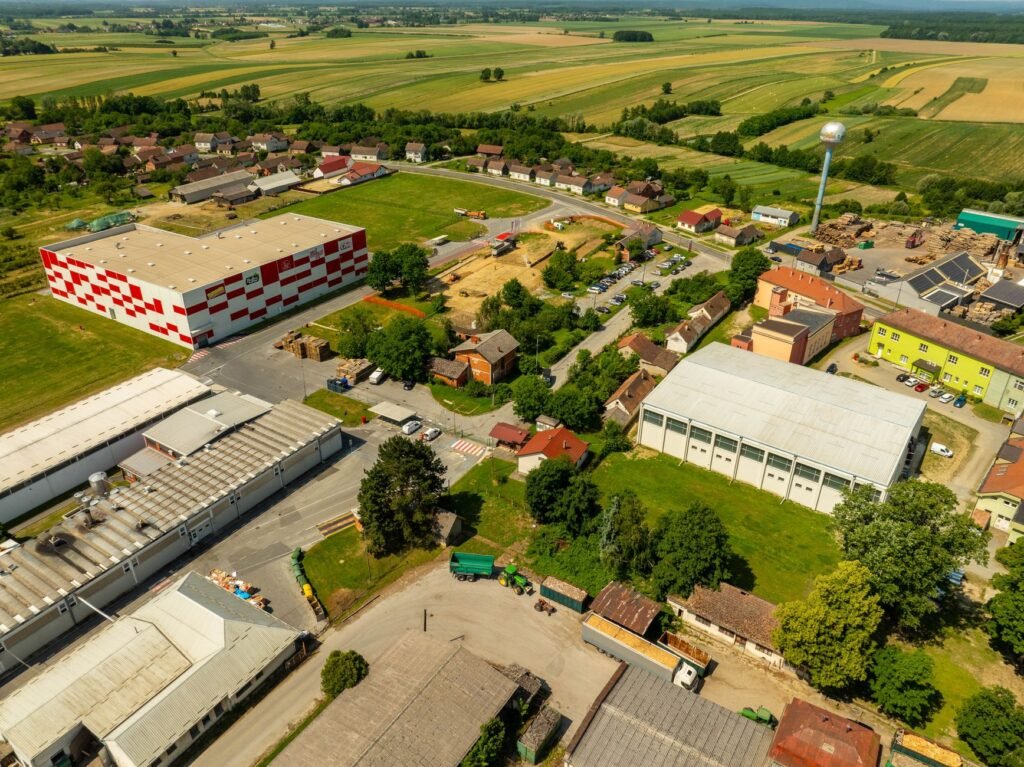 Aerial photograph of an industrial area in Hercegovac, Croatia, with rural surroundings.