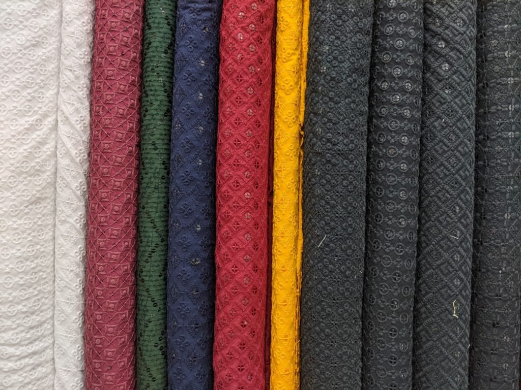 A close-up view of colorful textured fabric rolls showcasing intricate patterns.