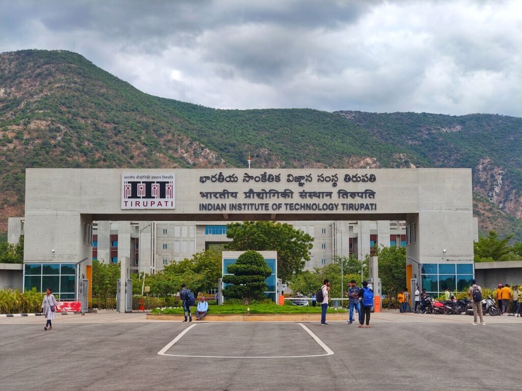 Main entrance of Indian Institute of Technology Tirupati with scenic mountains in background.