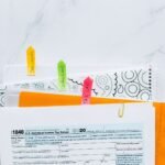 Colorful tabs organizing tax documents for easy filing and reference.
