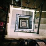 Looking down a spiral staircase in Ciudad de Chiautla, Puebla with visible railings and steps.