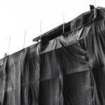 Black and white image of a construction site covered with protective sheeting in Vietnam.