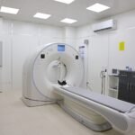 Bright and sterile hospital imaging room featuring a state-of-the-art CT scanner.