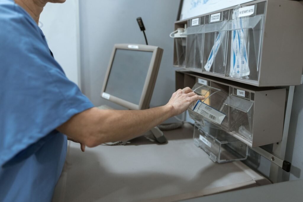 A medical professional organizing supplies in a hospital setting.