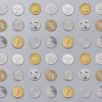 A seamless pattern of various cryptocurrency coins in gold and silver tones.