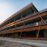 Contemporary architecture of a school building in Delhi, India, captured at dusk with ornate designs.