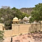 Aerial view of the iconic Panna Meena Ka Kund with traditional architecture and lush greenery in Jaipur, Rajasthan.