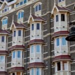 Detailed view of the historic Taj Mahal Palace facade in Mumbai, showcasing its Victorian architecture.