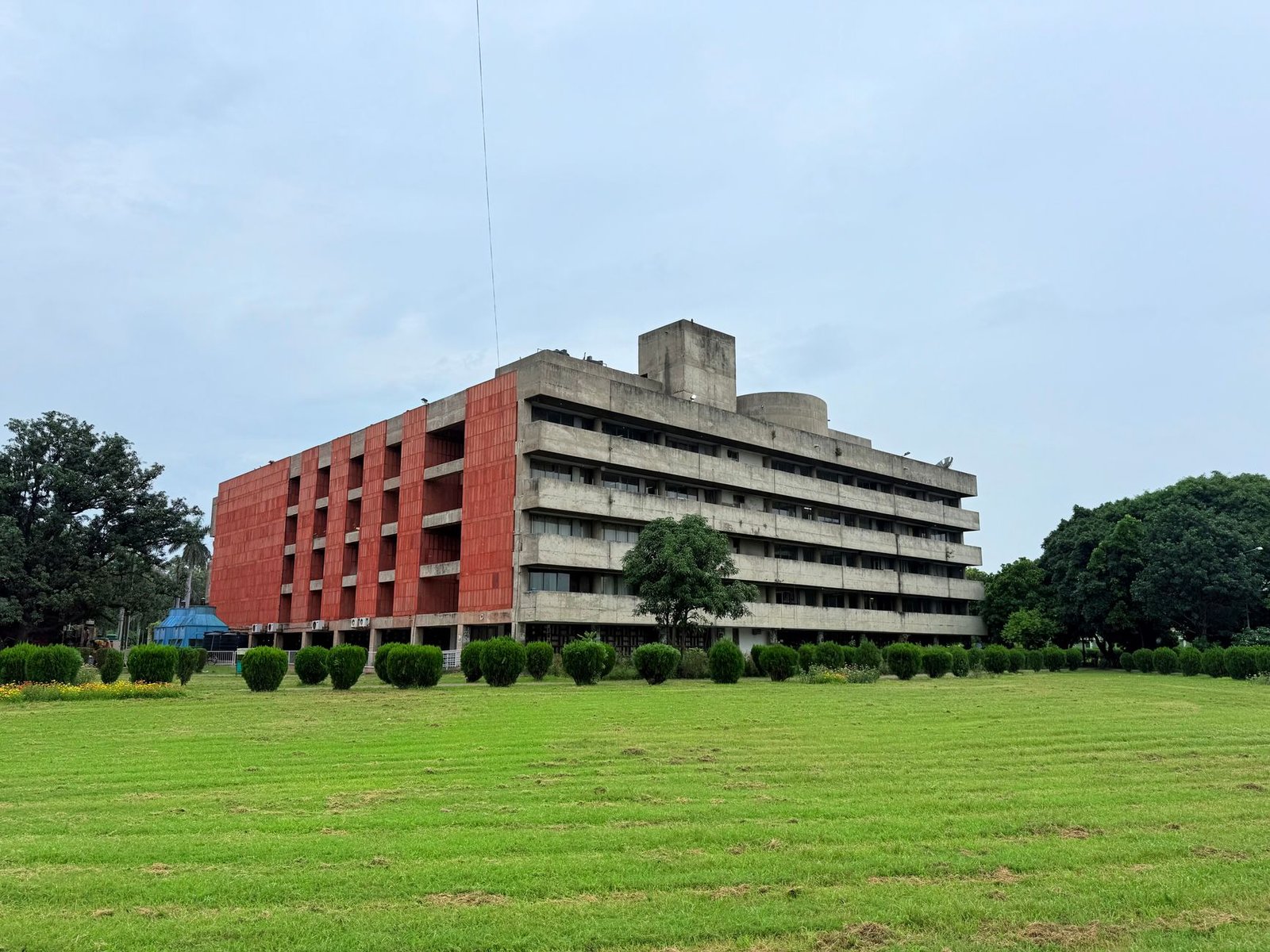 Concrete BR Ambedkar Administrative Building nestled in green garden, Chandigarh.