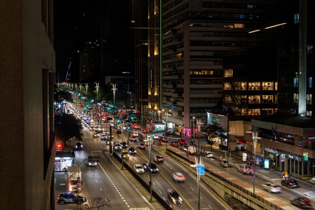 Vibrant night view of bustling Paulista Avenue in São Paulo, Brazil, showcasing the city's dynamic architecture.