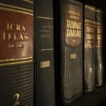 Detailed close-up of law and regulation books on a bookshelf, emphasizing education and knowledge.