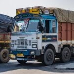 Vibrant Tata truck on an Indian highway near Deeg, Uttar Pradesh showcasing cultural designs.