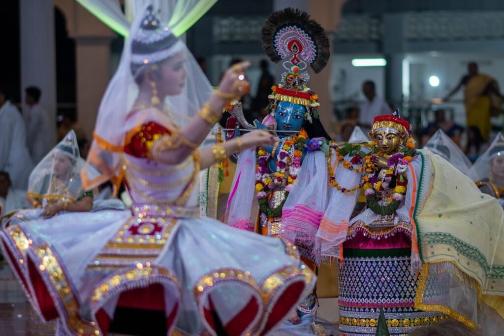 Authentic Manipuri Raas Leela dance with vibrant costumes in Imphal, Manipur, India during Basanta Purnima festival.